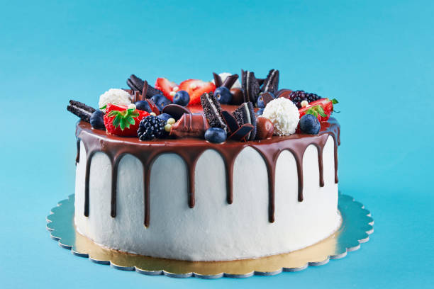 istock Cake decorated with strawberry and chocolate on blue background 1438216603