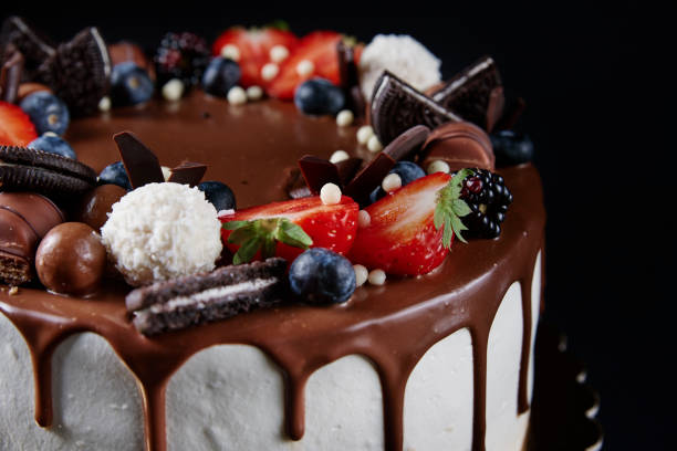 istock Cake decorated with strawberry and chocolate on dark background 1438216609