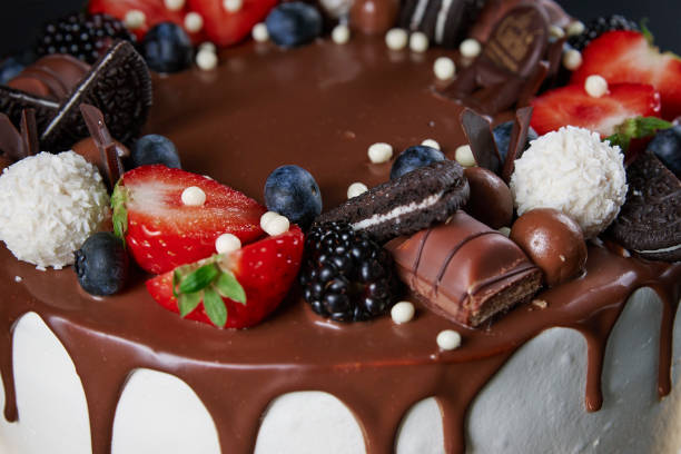 istock Cake decorated with strawberry and chocolate on dark background 1438216613
