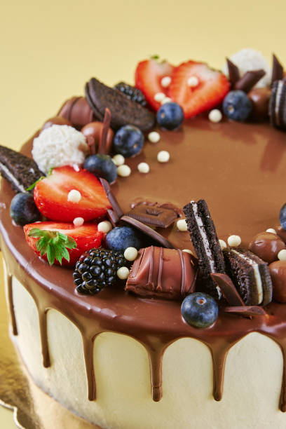 istock Cake decorated with strawberry and chocolate on yellow background 1438216617