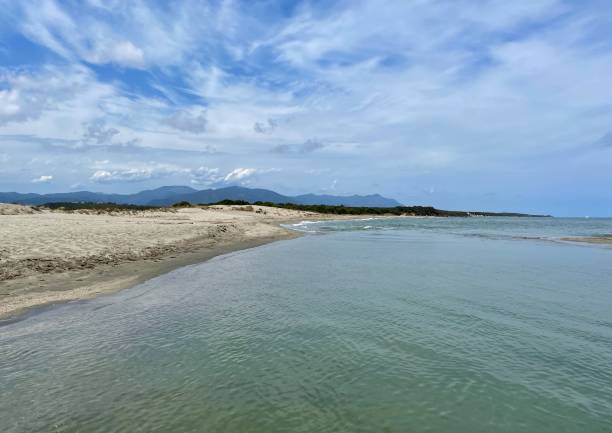 istock Deserted sandy beach with mountains in the background. 1438216722
