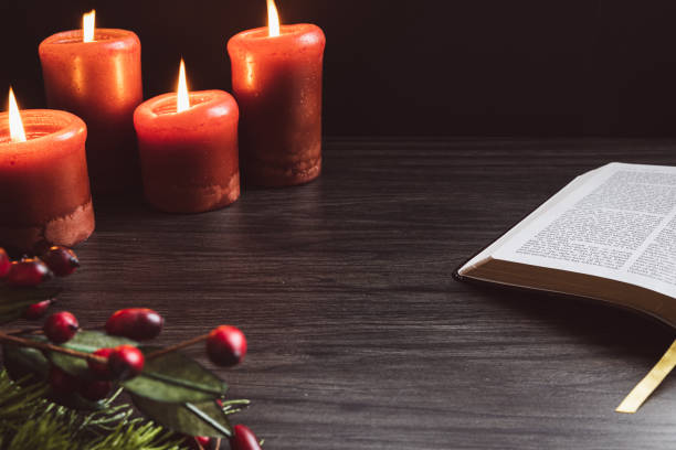istock Open bible and red candles 1438218526