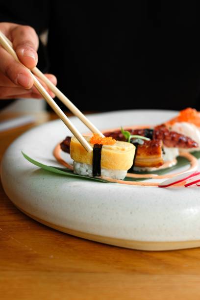istock Closeup of garnished seafood on a white plate 1438218633
