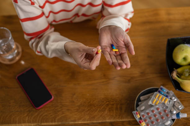 istock Hand full of medicine 1438220149