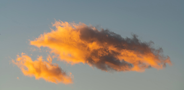 Beautiful blue sky with sunset clouds.