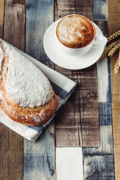 istock fresh loaf of bread and coffee 1438222102
