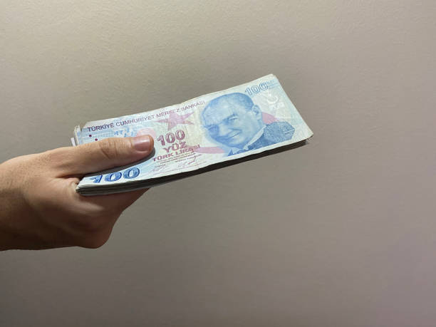 Turkish banknotes, Turkish money, Turkish lira, a hand holding Turkish banknotes stock photo