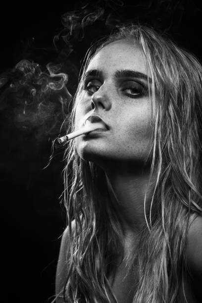 istock young woman smoking 1438223104