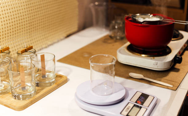 istock the process of making natural candles in glasses 1438223176