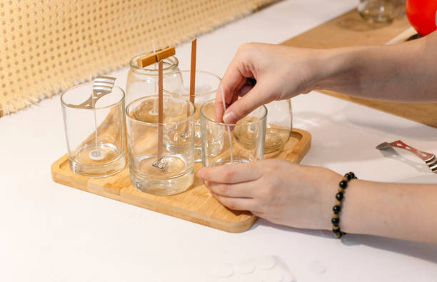 istock the process of making natural candles in glasses 1438223178