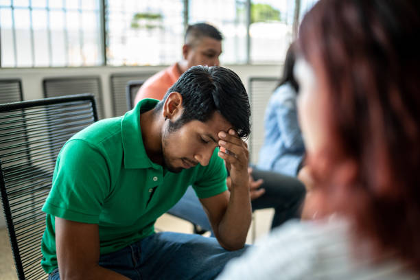 istock Depressed mid adult man during a group therapy 1438223733