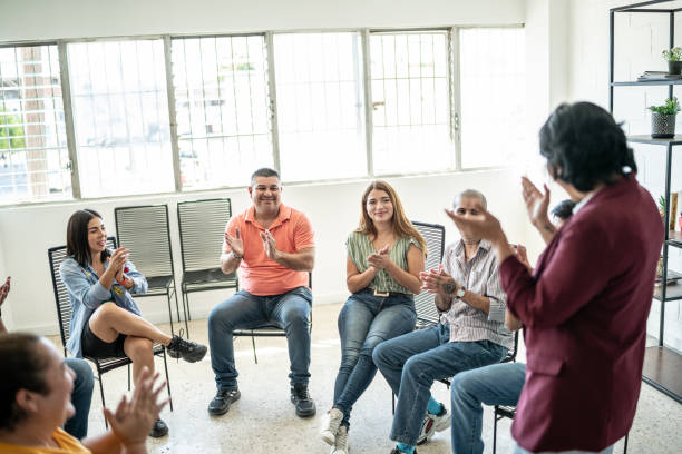 People applauding during a meeting