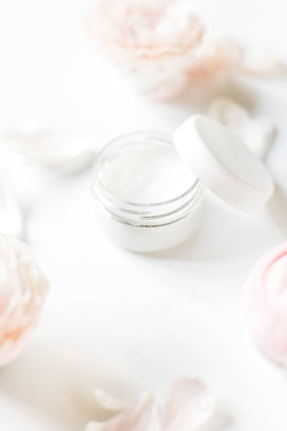 istock facial cosmetics and flowers on a white background. self-care 1438226442