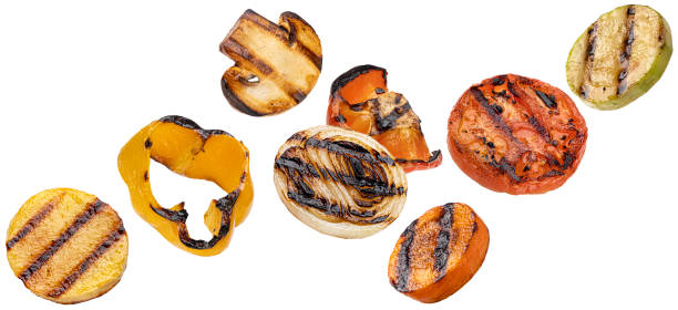 fette di verdure grigliate che cadono isolate su sfondo bianco - grilled vegetable eggplant zucchini foto e immagini stock