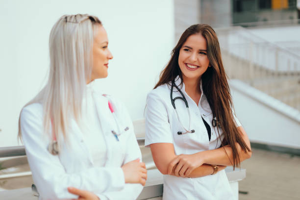 istock Two medical students in front of a hospital 1438230932