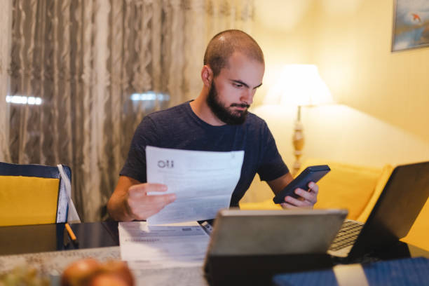 Man Using Inflation Calculator 10,500+ Inflation Calculator Stock Photos, Pictures & Royalty-Free ...
