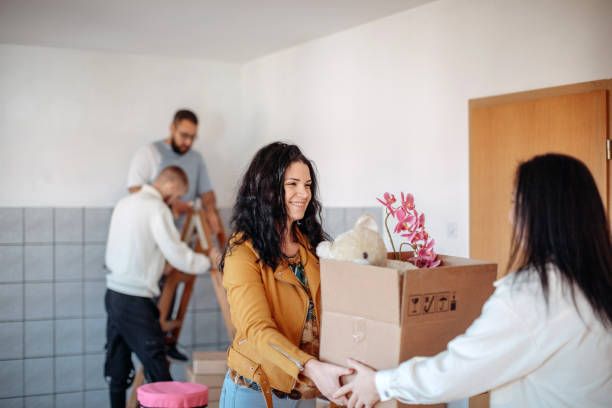 istock Friends moving into new apartment together 1438232213