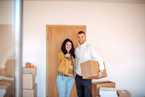 istock Young couple moving into new apartment together 1438232215