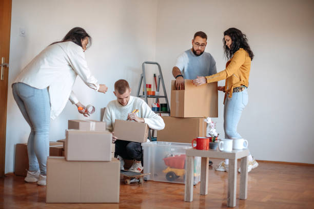 istock Friends moving into apartment together 1438233893