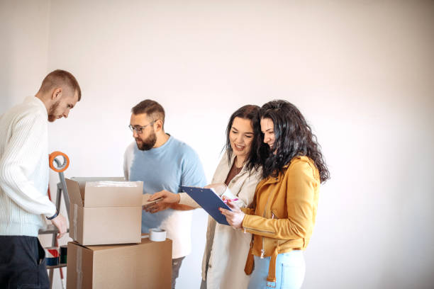 istock Friends moving into apartment together 1438234728