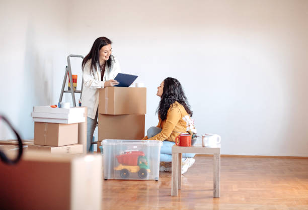 istock Friends moving into apartment together 1438235985