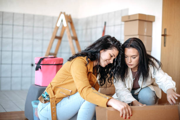 istock Friends moving into apartment together 1438236171