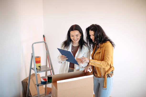 istock Friends moving into apartment together 1438236281