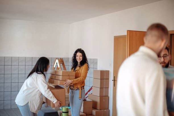 istock Friends moving into new apartment together 1438239210