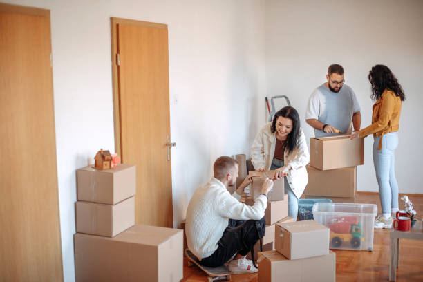 istock Friends moving into apartment together 1438239514