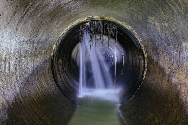 istock Leak of water into round sewer tunnel 1438242779