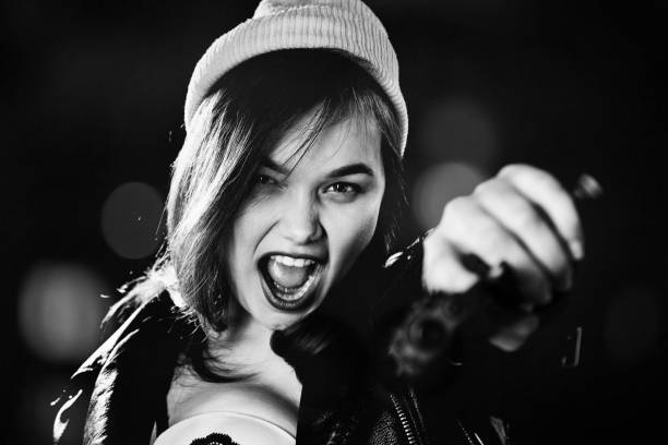 istock girl with gun 1438246900