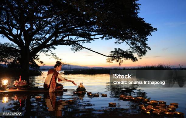 Asia Woman In Thai Dress Traditional Hold Kratong And Bring Krathong To Float In Loi Kratong Day Of Thailand Loi Krathong Traditional Festival Held Every November To Pray Respect To Water Goddess Stock Photo - Download Image Now
