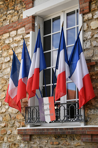 PARIS, FRANCE - SEPTEMBER 03, 2022: Hotel de Ville City Hall with french flags