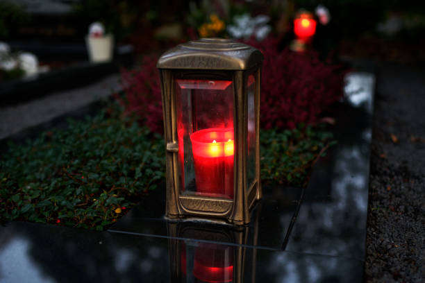 istock grave lantern with burning candle at dusk 1438249707
