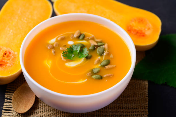 Butternut squash pumpkin soup Butternut squash pumpkin soup in bowl, Homemade food in autumn season squash soup stock pictures, royalty-free photos & images