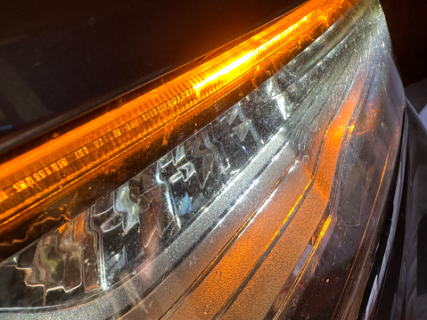 Detail on one of the LED headlights of a car.