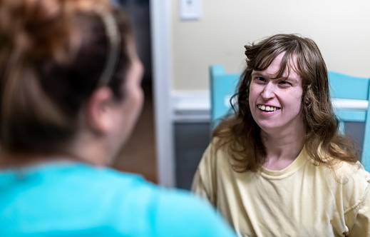 Young adult with De Barsy Syndrome is taken care of some evenings by a caregiver so her mother can run errands.