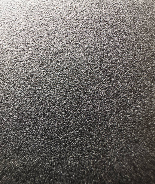 istock Black table wood texture with macro lens. Micro pores and imperfections 1438252940