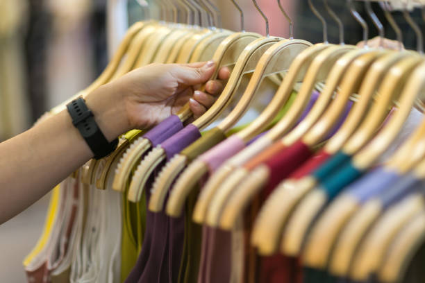 istock Clothes that are arranged on shelves and hangers 1438253348