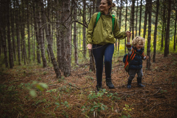 istock Mother and son in a forest walk 1438254244