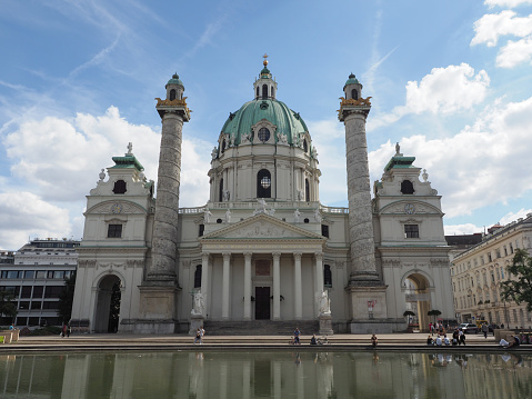 25 October 2019 Vienna, Austria -Wiener Karlskirche / Saint Charles's Church. Many tourists on streets. Art landmark.