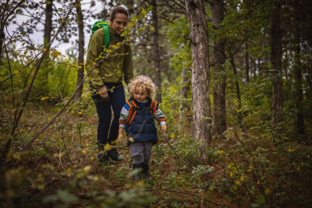 istock Mother and son in a forest walk 1438260037