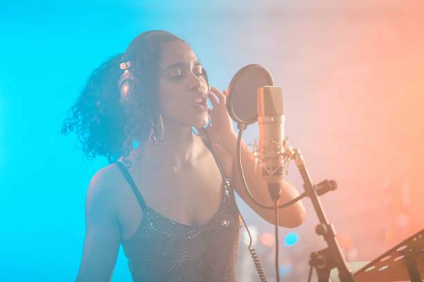 istock Engaged Hispanic Young Singer in Recording Studio 1438260335