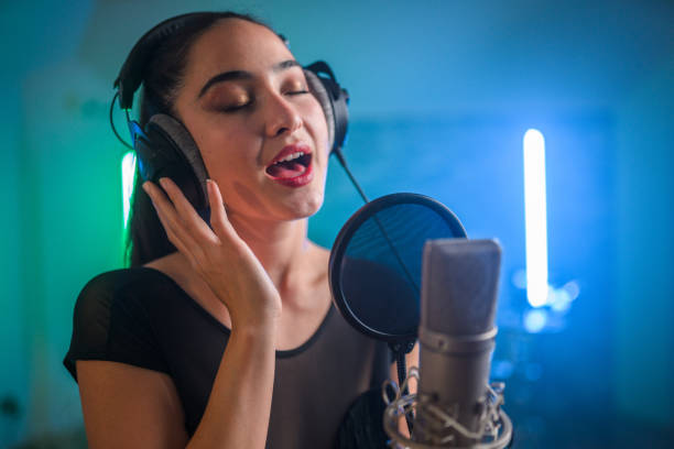 istock Young Asian Beautiful Woman Singing in Recording Studio 1438260409