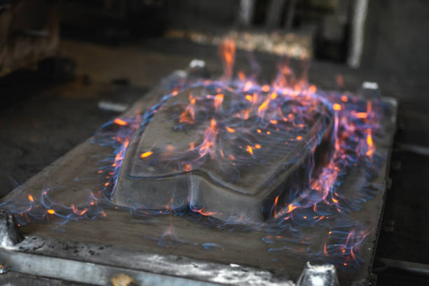 Iron cast burning on fire in a factory. Foundry and casting processes.