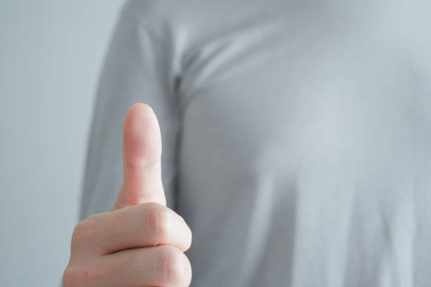 istock Customer Experience and Satisfaction Concept, Best Excellent Services Rating, Good, Positive emotion. Man show thumb up. 1438262334