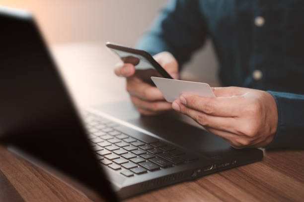 istock Man using credit card for purchasing and shopping online on mobile phone. Mobile payment with wallet app technology. Digital money transfer, banking and e commerce concept. 1438263503