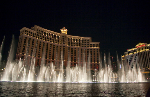 Las Vegas. USA. 10.25.2023. Beautiful view of Bellagio Hotel casino with fountains creating magical ambiance against backdrop of evening sky.