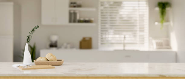istock White marble kitchen islands or countertop with copy space over blurred minimal white kitchen 1438266619