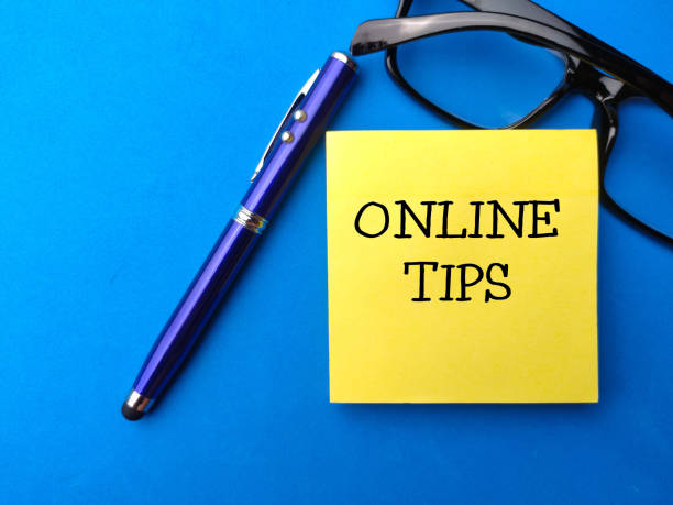 istock Top view pen,glasess and sticky note with the word ONLINE TIPS. 1438268679